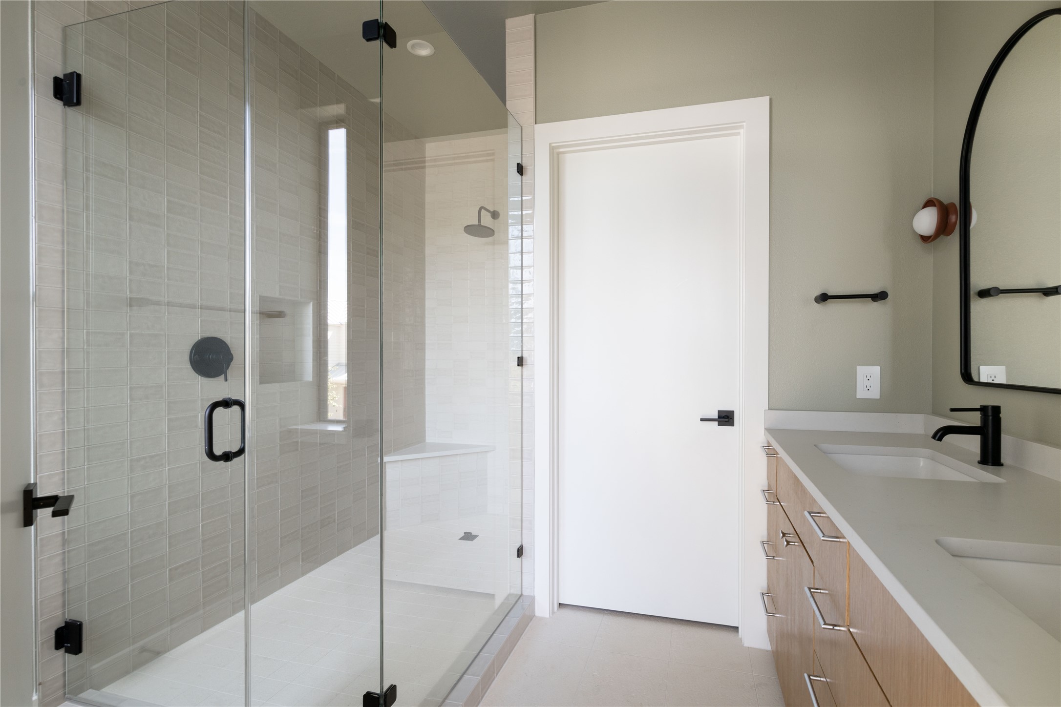 3006 Sorin Street Austin, TX 78723 - Photo 15 of 27 a bathroom with a shower sink and mirror