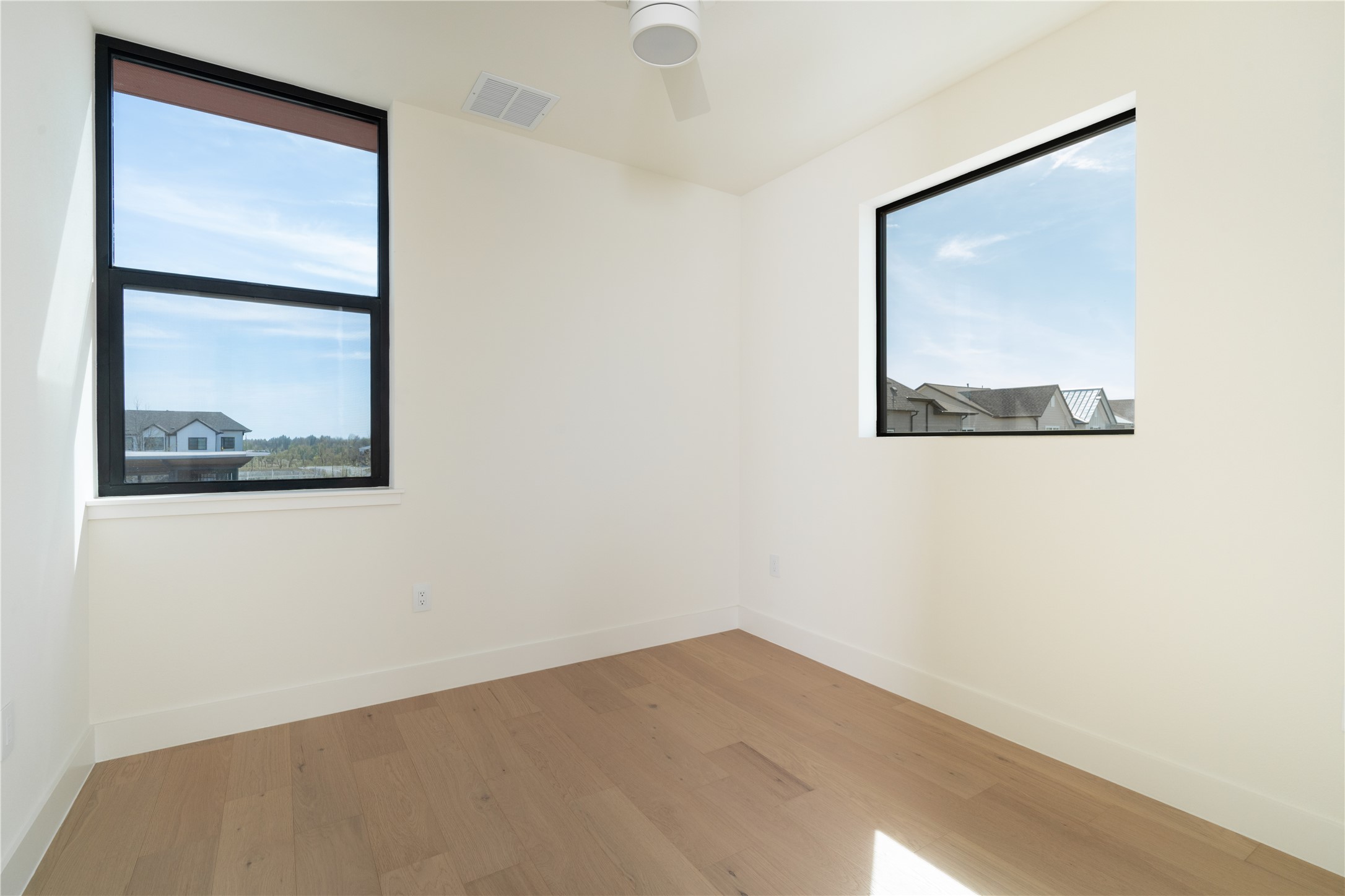 3006 Sorin Street Austin, TX 78723 - Photo 18 of 27 a view of a small space with wooden floor and a window