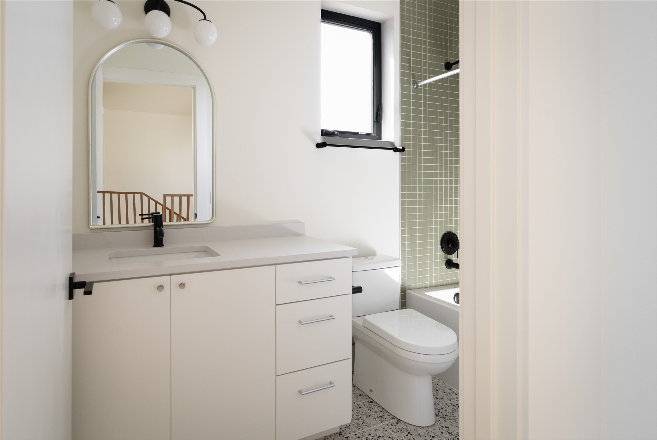 3006 Sorin Street Austin, TX 78723 - Photo 19 of 27 a bathroom with a toilet a sink and mirror