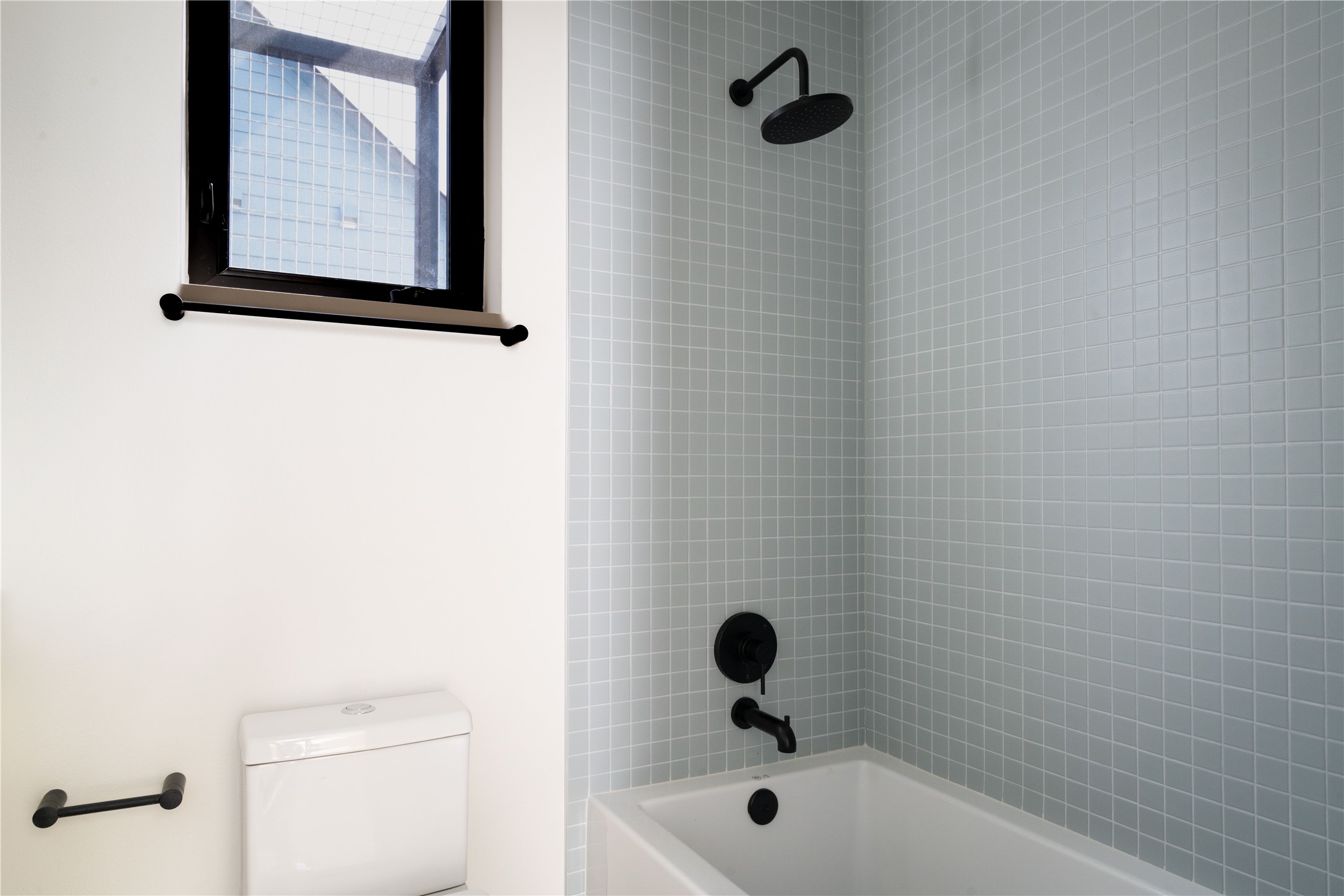3006 Sorin Street Austin, TX 78723 - Photo 26 of 27 a bathroom with a shower and a toilet