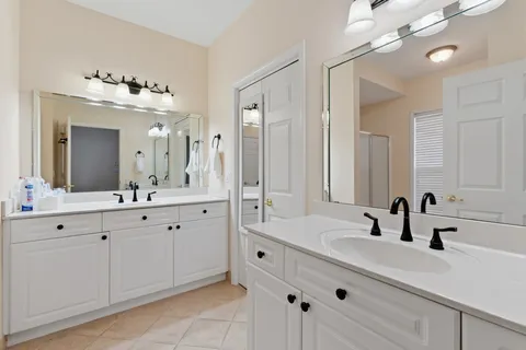 a bathroom with a shower and a window