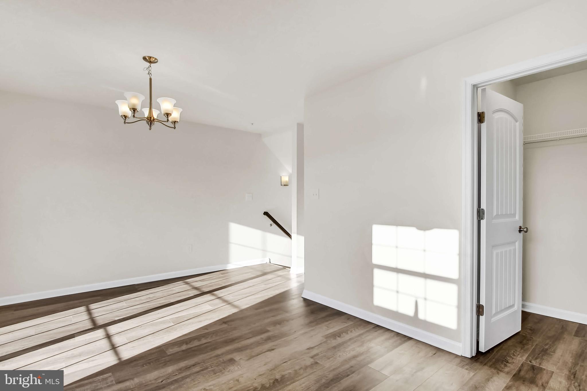 51 Overlook Dr., Unit I Hanover, PA 17331 - Photo 9 of 14 an empty room with wooden floor and windows