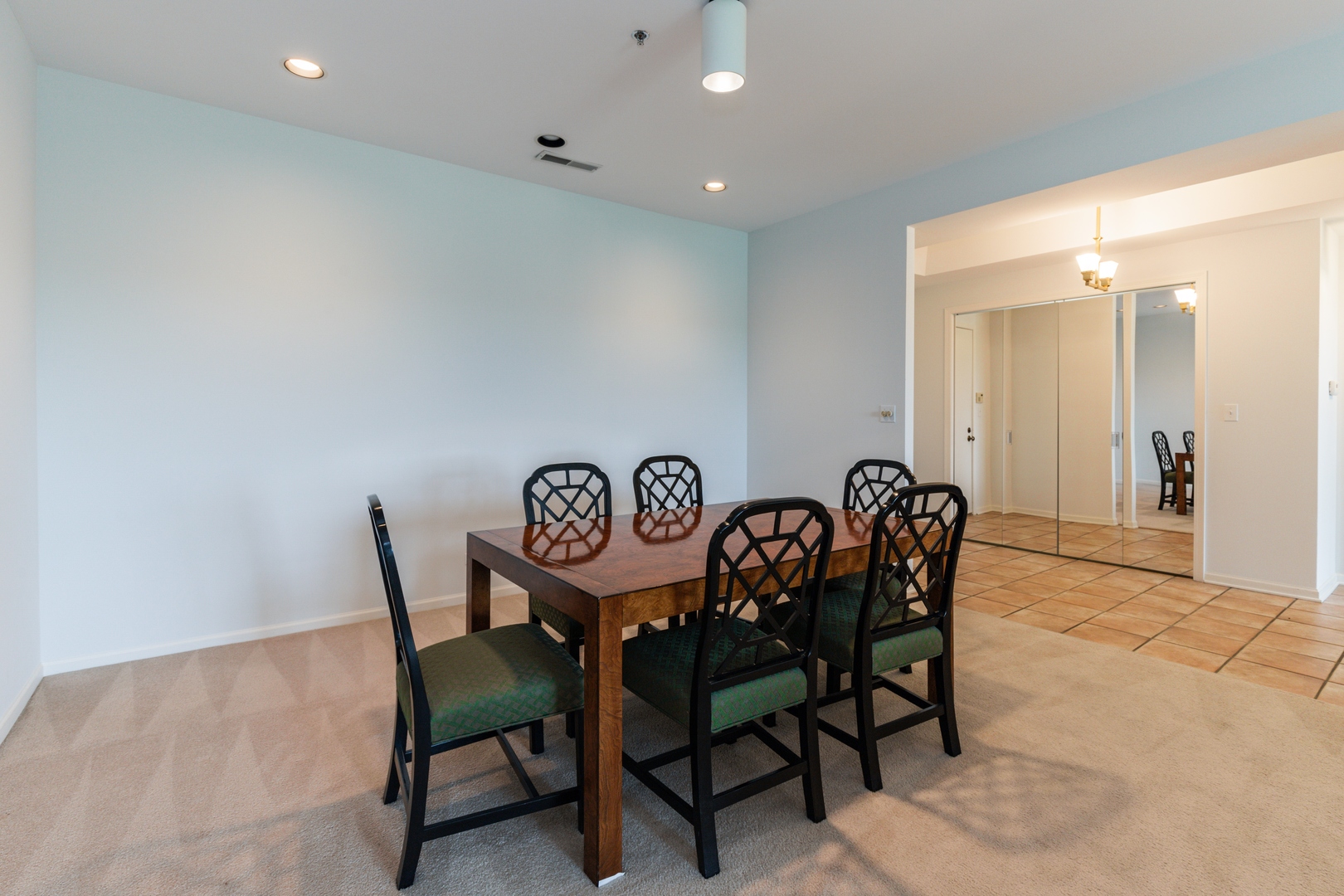 211 Rivershire Lane, Unit 501 Lincolnshire, IL 60069 - Photo 4 of 17 a view of a dining room with furniture