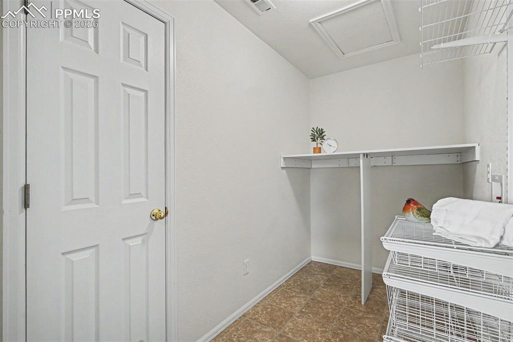 12210 Crystal Downs Road Peyton, CO 80831 - Photo 25 of 40 a bedroom with a bed and a window