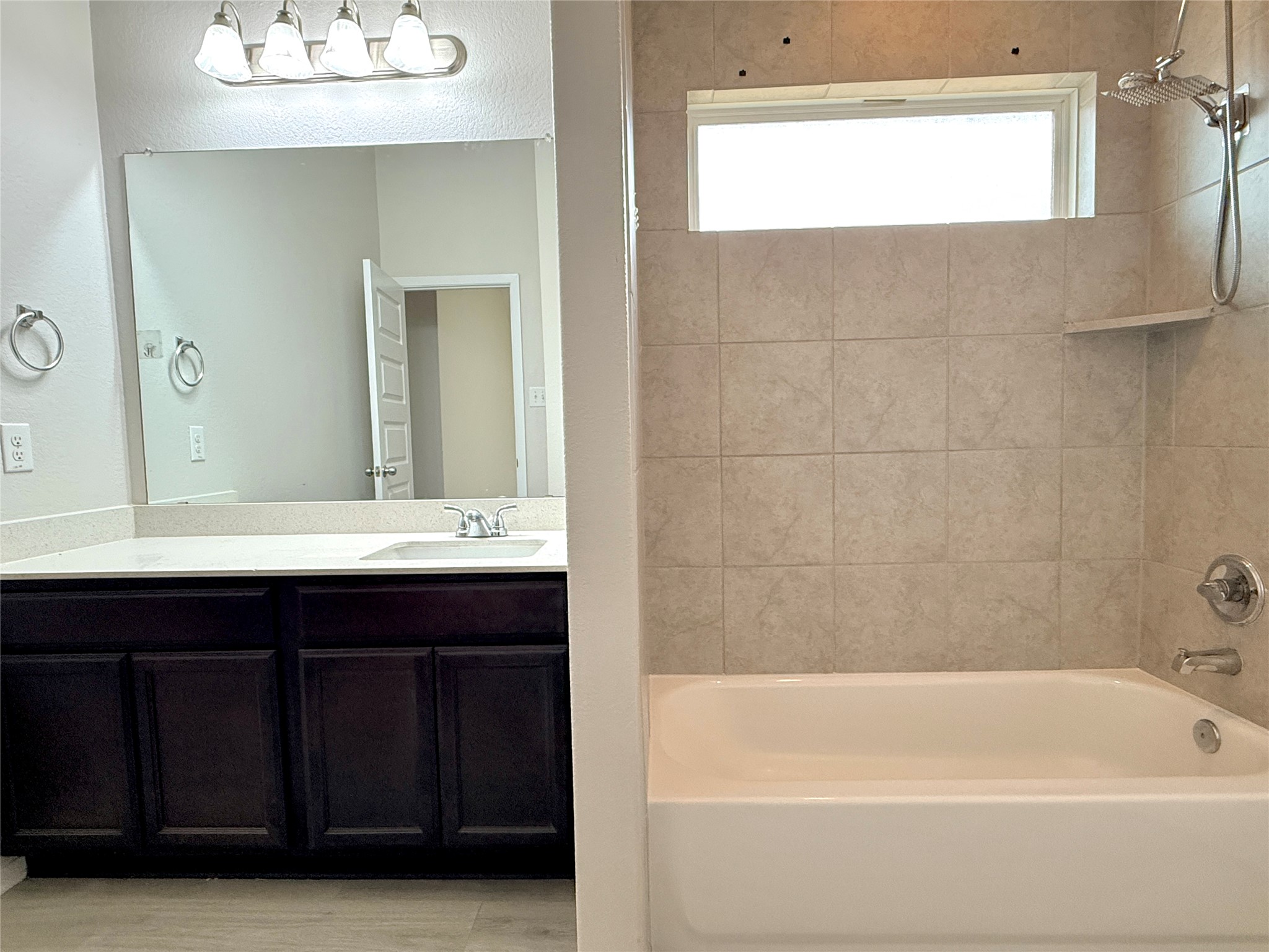 5629 Corso Court Austin, TX 78747 - Photo 16 of 23 Bathroom featuring vanity and shower / tub combination