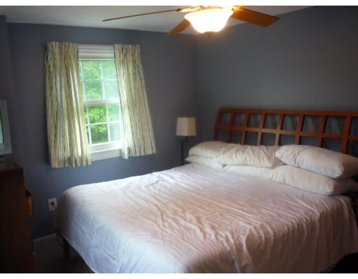 427 Treble Cove Road Billerica, MA 01862 - Photo 16 of 23 a large bed sitting in a bedroom next to a window