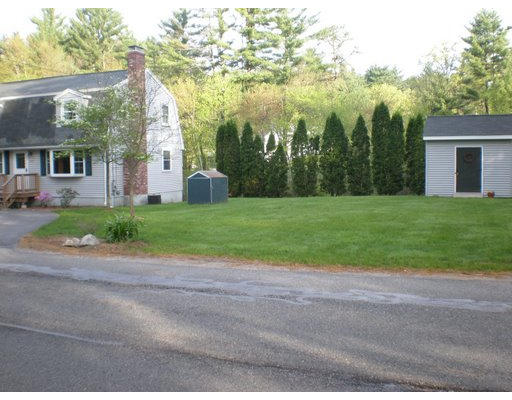 427 Treble Cove Road Billerica, MA 01862 - Photo 20 of 23 a view of a house with a yard and large trees