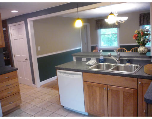 427 Treble Cove Road Billerica, MA 01862 - Photo 3 of 23 a kitchen with sink refrigerator and window
