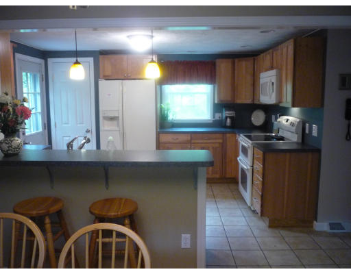 427 Treble Cove Road Billerica, MA 01862 - Photo 4 of 23 a kitchen with stainless steel appliances a sink stove and cabinets