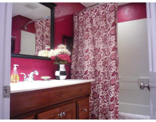 427 Treble Cove Road Billerica, MA 01862 - Photo 10 of 23 a bathroom with a sink and a mirror