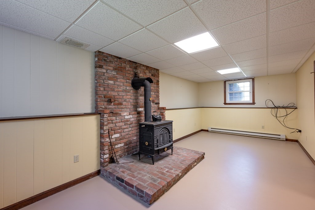 12 Middle Road Southampton, MA 01073 - Photo 25 of 25 a view of a livingroom with wooden floor and a fireplace