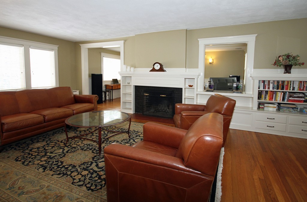 18 Intervale Road Wellesley, MA 02481 - Photo 5 of 11 a living room with furniture fireplace and a window