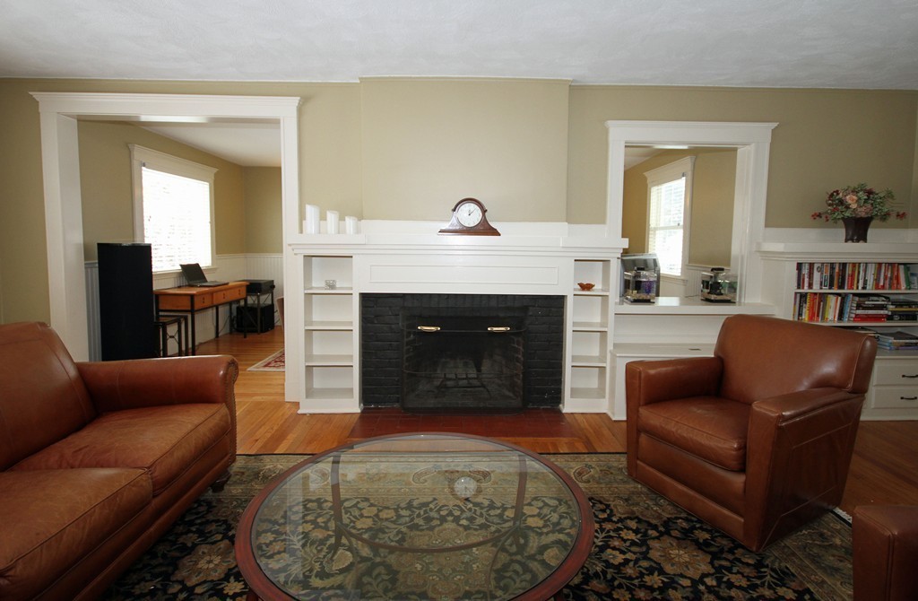 18 Intervale Road Wellesley, MA 02481 - Photo 6 of 11 a living room with furniture and a fireplace