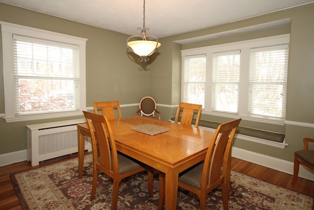 18 Intervale Road Wellesley, MA 02481 - Photo 8 of 11 a view of a dining room and livingroom with furniture wooden floor and a rug