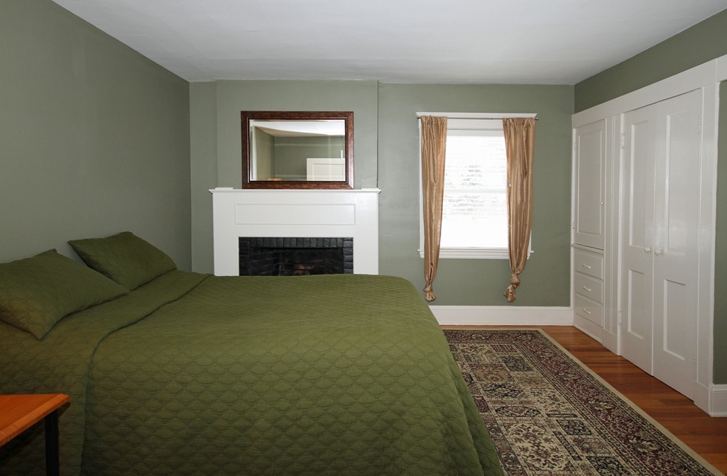 18 Intervale Road Wellesley, MA 02481 - Photo 9 of 11 a bedroom with a bed and a window