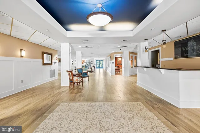 a view of a living room and kitchen