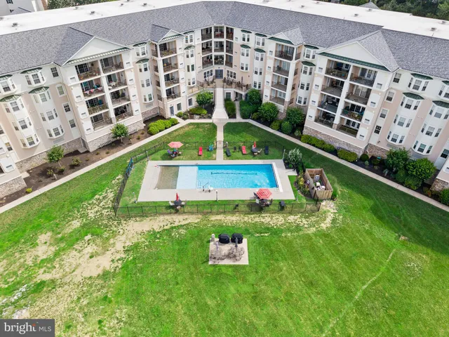 an aerial view of a house with a big yard