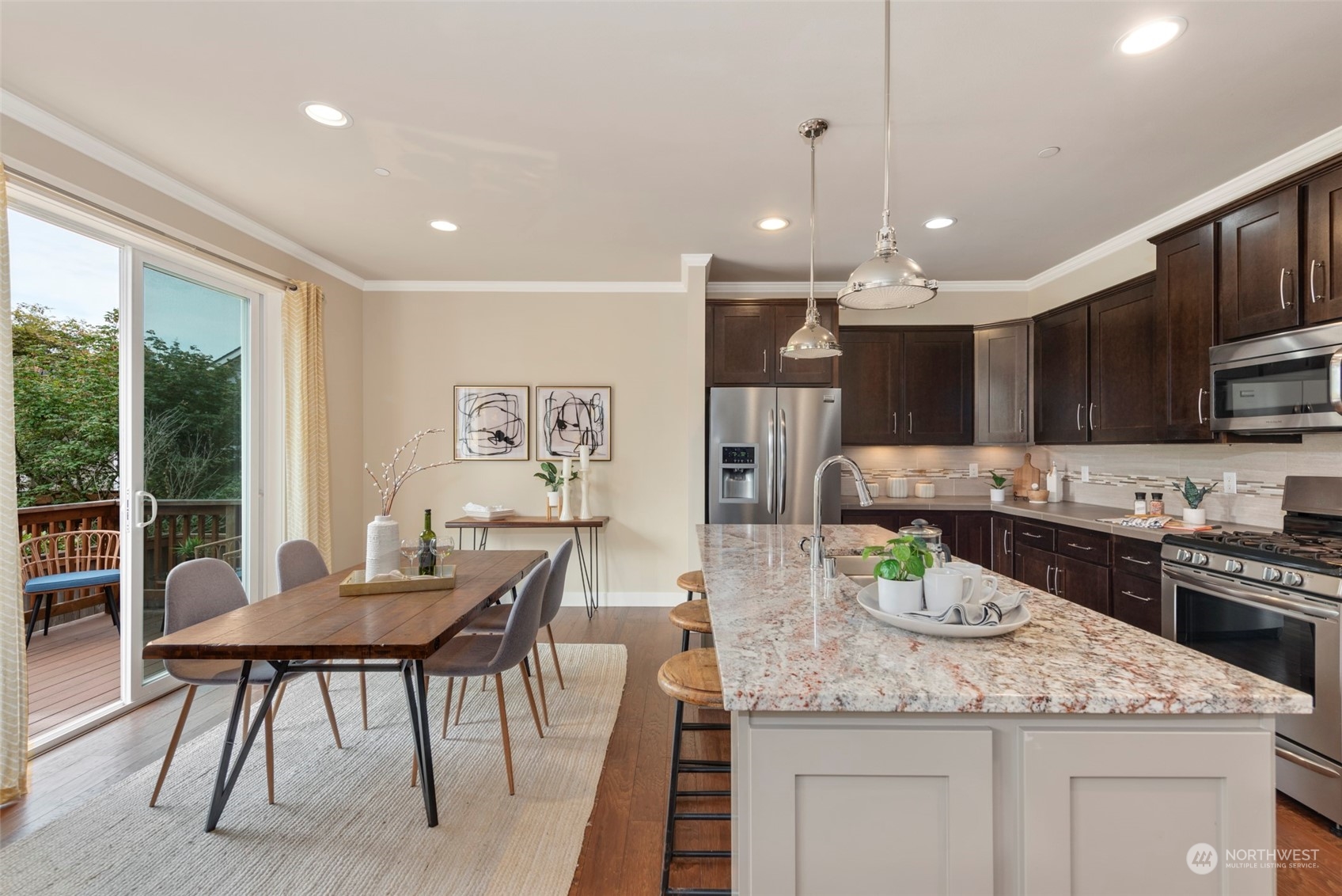 2406 196th Place Southeast Bothell, WA 98012 - Photo 11 of 30 a kitchen with kitchen island granite countertop lots of counter top space and stainless steel appliances