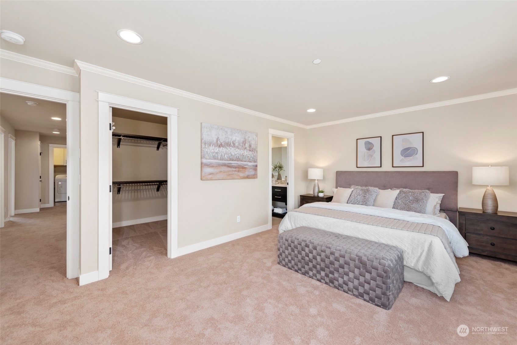 2406 196th Place Southeast Bothell, WA 98012 - Photo 16 of 30 a spacious bedroom with a bed and a walk in closet