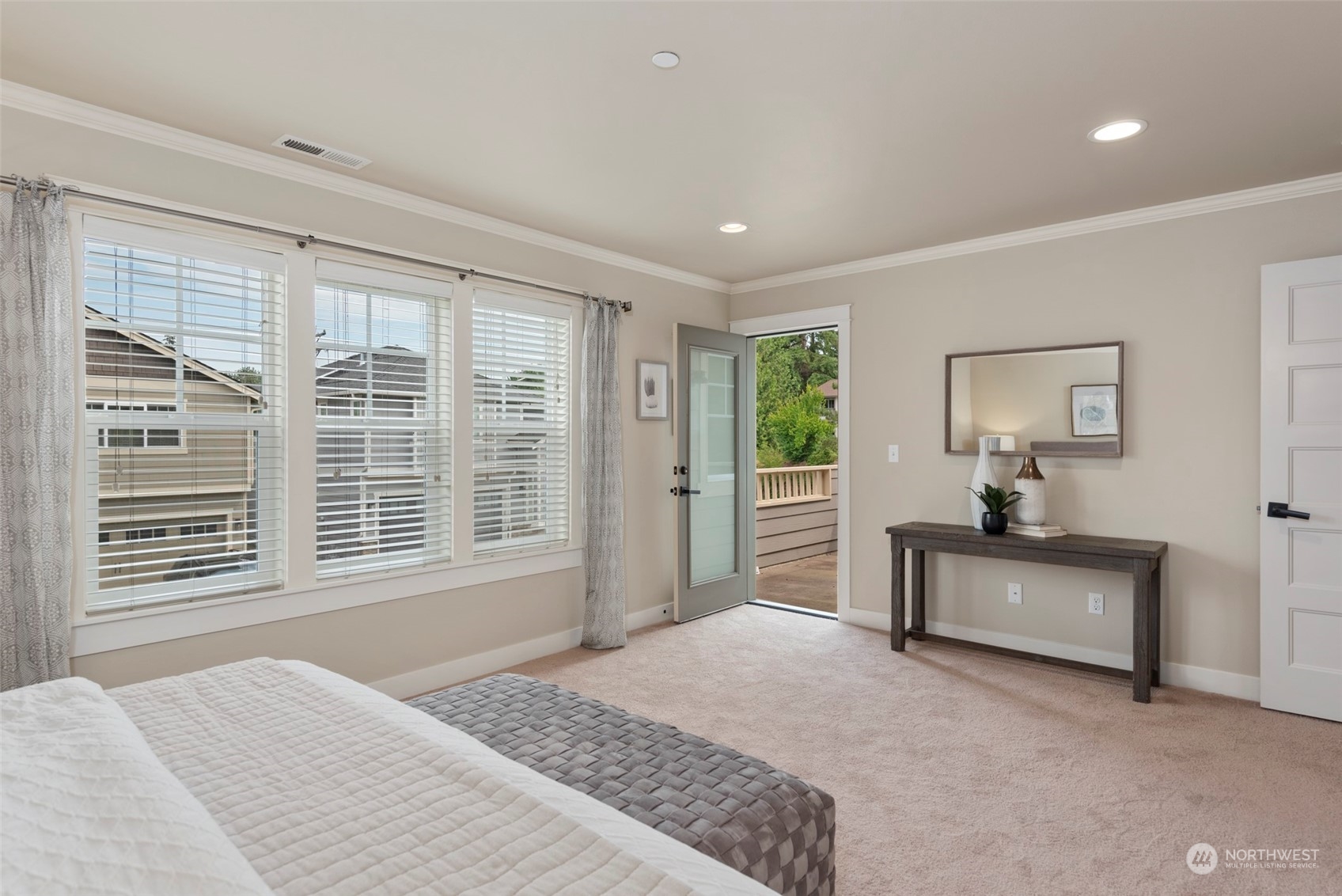 2406 196th Place Southeast Bothell, WA 98012 - Photo 17 of 30 a spacious bedroom with a large bed and a window