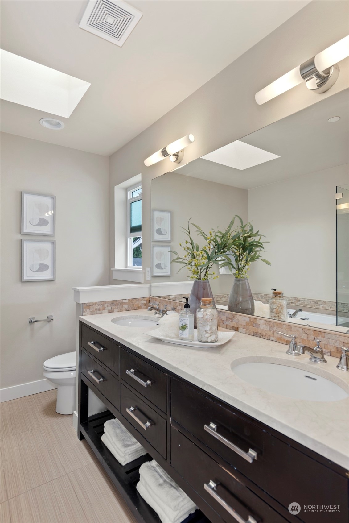 2406 196th Place Southeast Bothell, WA 98012 - Photo 22 of 30 a bathroom with a granite countertop sink a toilet and a large mirror