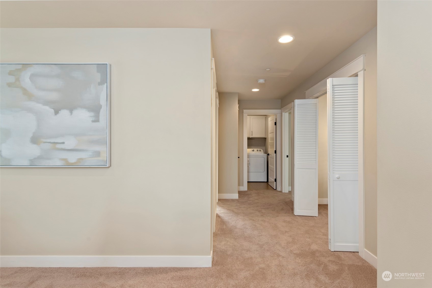 2406 196th Place Southeast Bothell, WA 98012 - Photo 26 of 30 a view of a hallway with wooden shelves