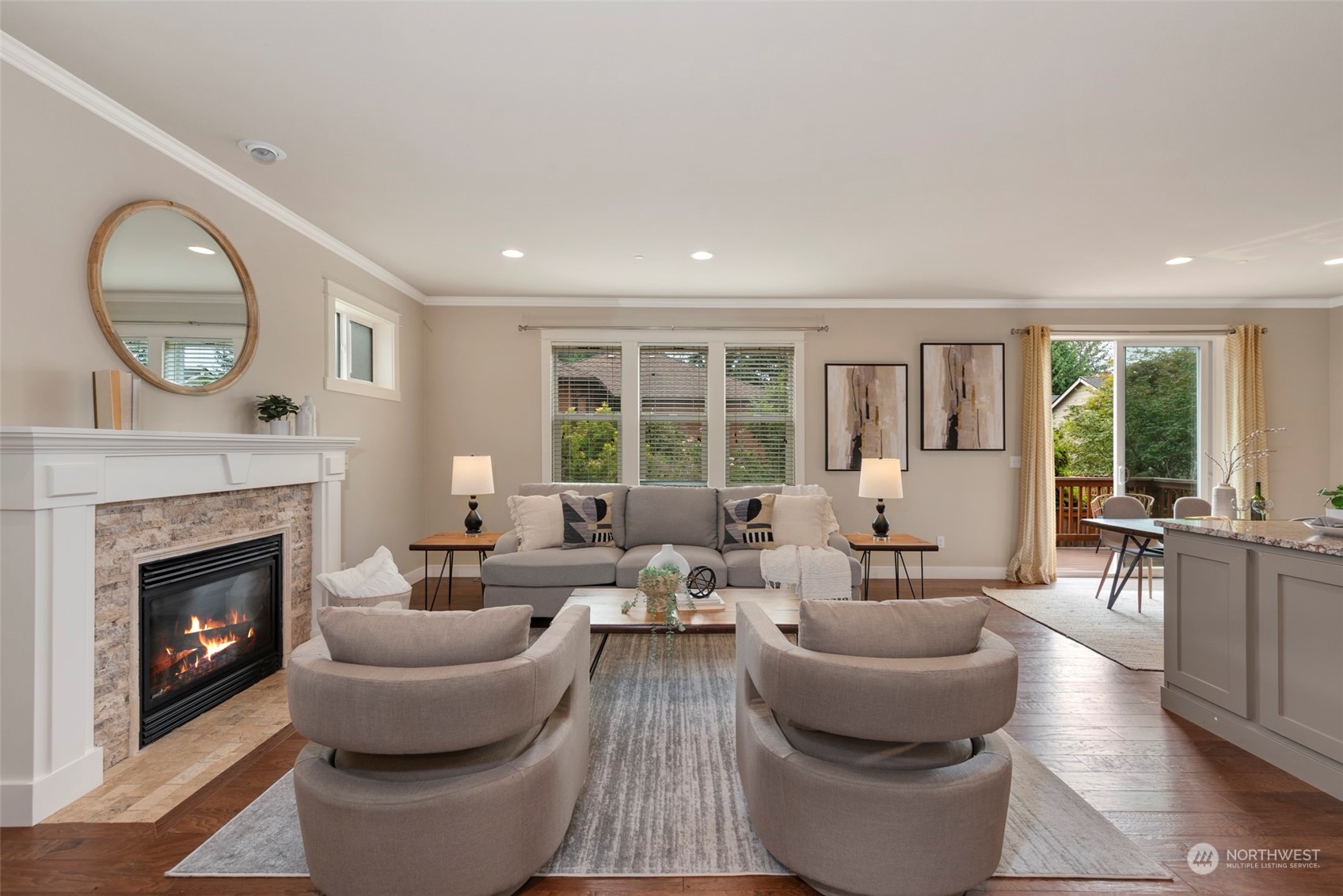 2406 196th Place Southeast Bothell, WA 98012 - Photo 5 of 30 a living room with furniture a large window and a fireplace