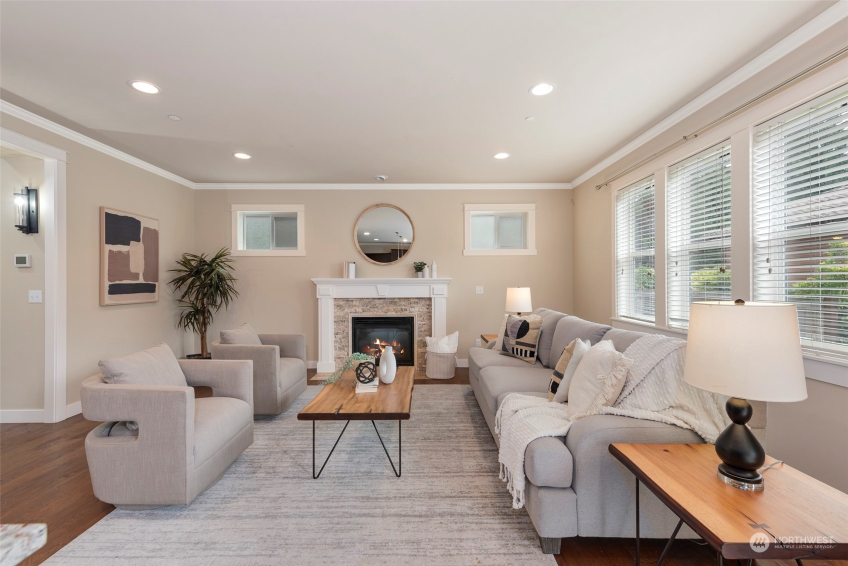 2406 196th Place Southeast Bothell, WA 98012 - Photo 6 of 30 a living room with furniture a fireplace and a large window