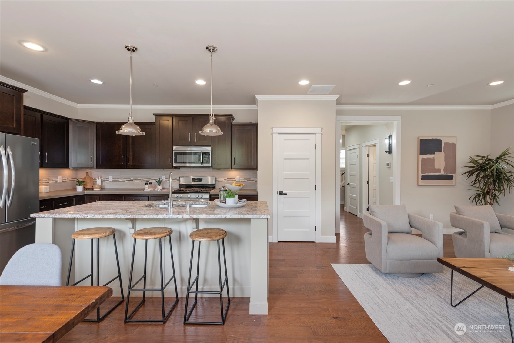 2406 196th Place Southeast Bothell, WA 98012 - Photo 8 of 30 a kitchen with stainless steel appliances granite countertop a stove a sink a refrigerator and a refrigerator