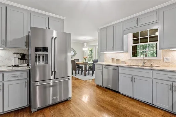 a bedroom with a bed and a television