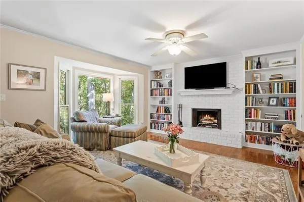 a front view of a house with a yard garage and outdoor seating