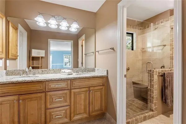 a kitchen with stainless steel appliances a refrigerator and a stove top oven
