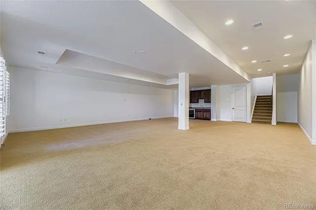 an empty room with a flat screen tv