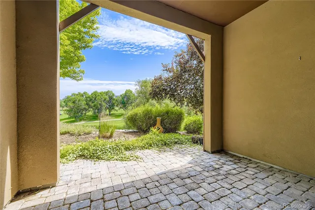 a view of a back yard from a corridor