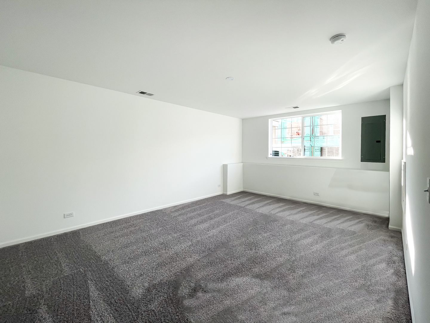 235 Regency Court, Unit B Wauconda, IL 60084 - Photo 6 of 23 an empty room with windows