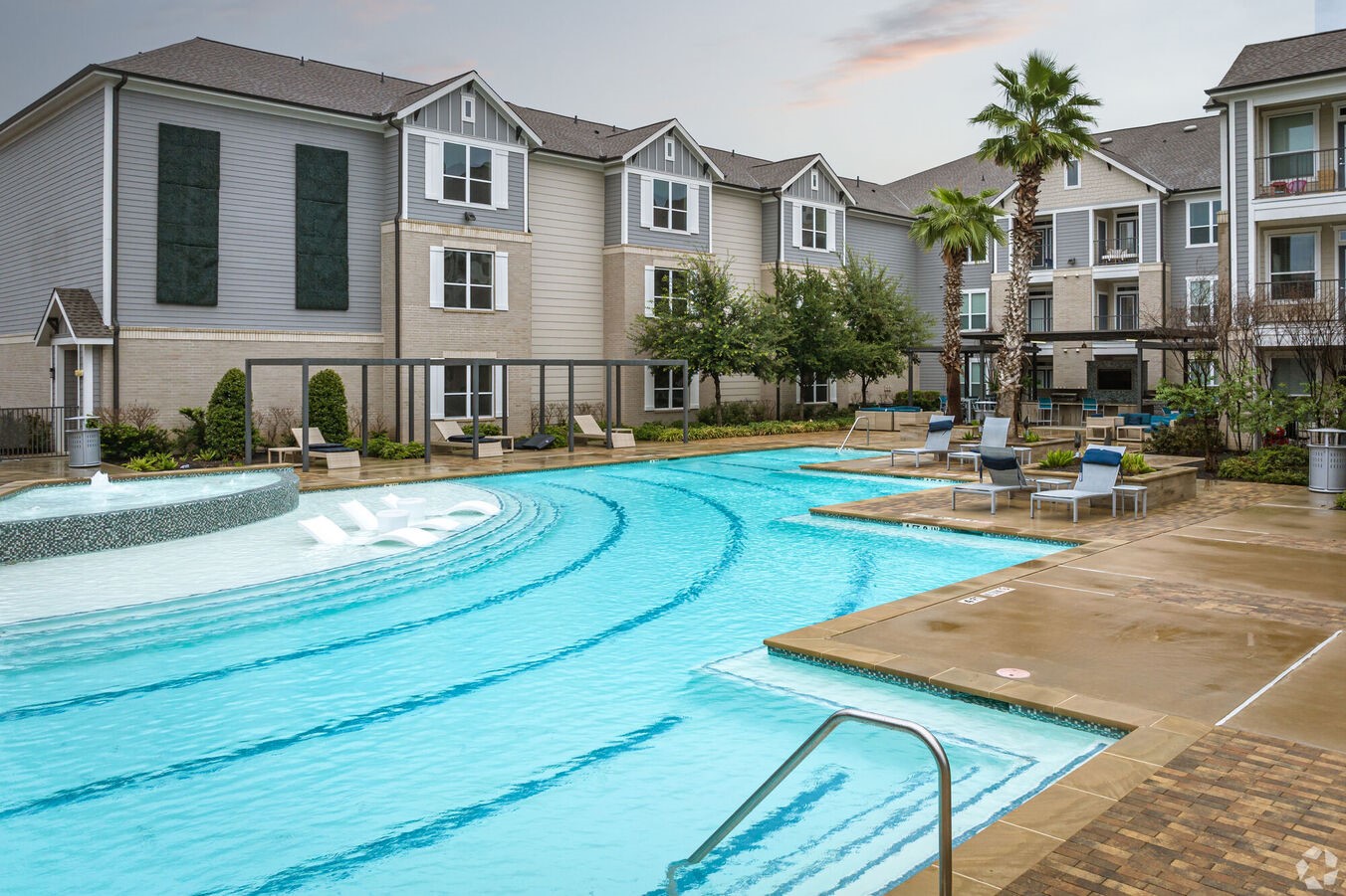 24002 Colonial Parkway, Unit 4334 Katy, TX 77493 - Photo 23 of 31 a view of a house with swimming pool and chairs