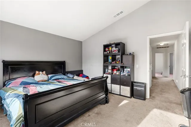 a bedroom with bed and closet