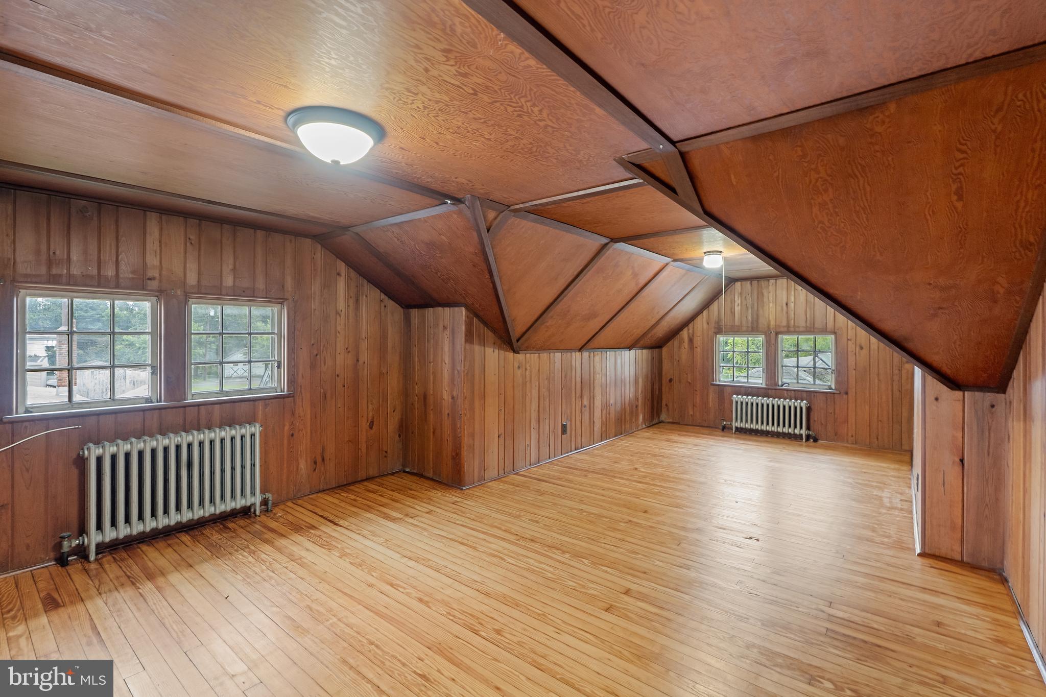 414 Main Street Dorchester, NJ 08316 - Photo 12 of 22 an empty room with wooden floor and windows