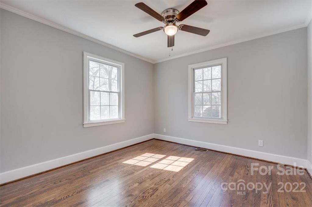 1211 Pinewood Road Rock Hill, SC 29730 - Photo 12 of 19 a view of empty room with wooden floor and fan