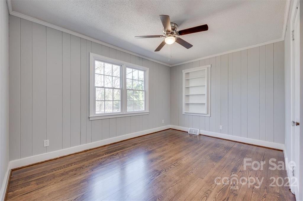 1211 Pinewood Road Rock Hill, SC 29730 - Photo 15 of 19 a view of an empty room with wooden floor and a window