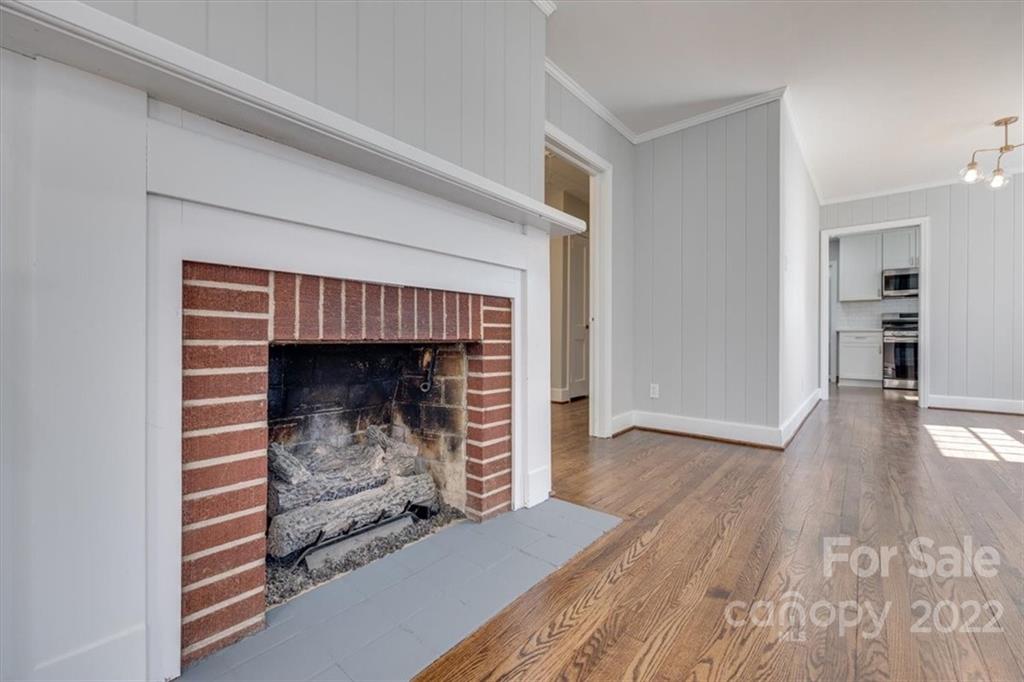 1211 Pinewood Road Rock Hill, SC 29730 - Photo 6 of 19 a room with fireplace and a wooden floor