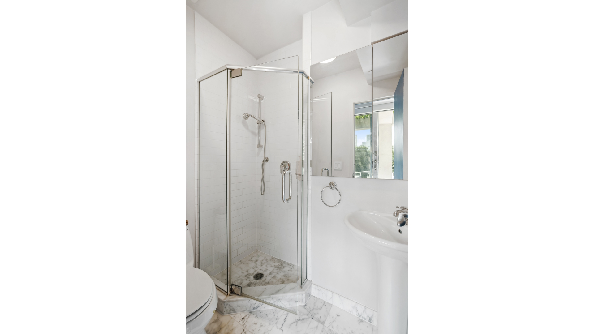 435 East 76th Street, Unit 6A Manhattan, NY 10021 - Photo 11 of 13 a bathroom with a glass shower door