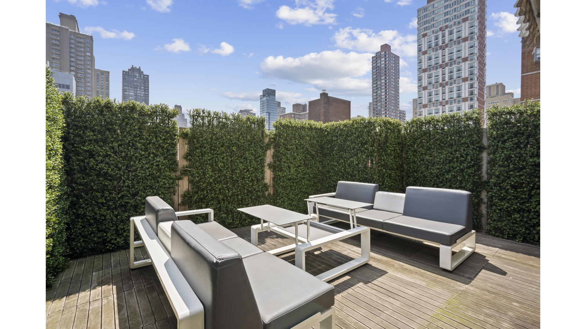 435 East 76th Street, Unit 6A Manhattan, NY 10021 - Photo 12 of 13 a couple of chairs sitting in roof of a city