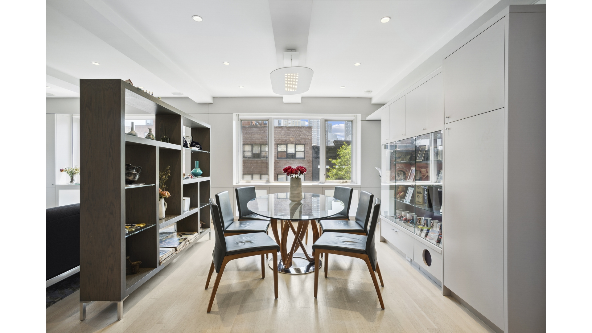 435 East 76th Street, Unit 6A Manhattan, NY 10021 - Photo 3 of 13 a dining room with furniture and window