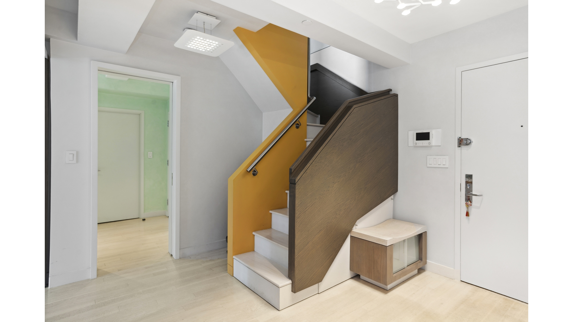 435 East 76th Street, Unit 6A Manhattan, NY 10021 - Photo 9 of 13 a view of entryway and kitchen