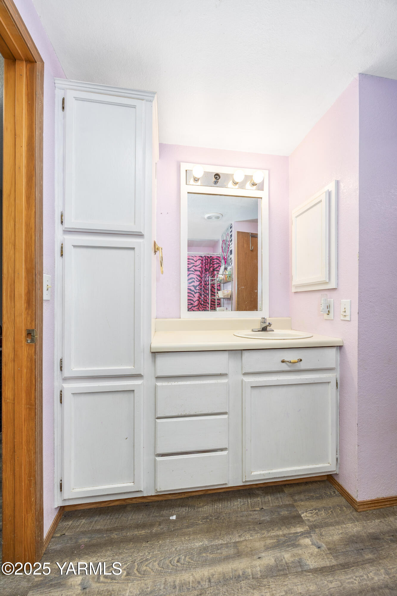 7702 North Griffin Road Grandview, WA 98930 - Photo 13 of 29 a view of cabinets with a wooden floor
