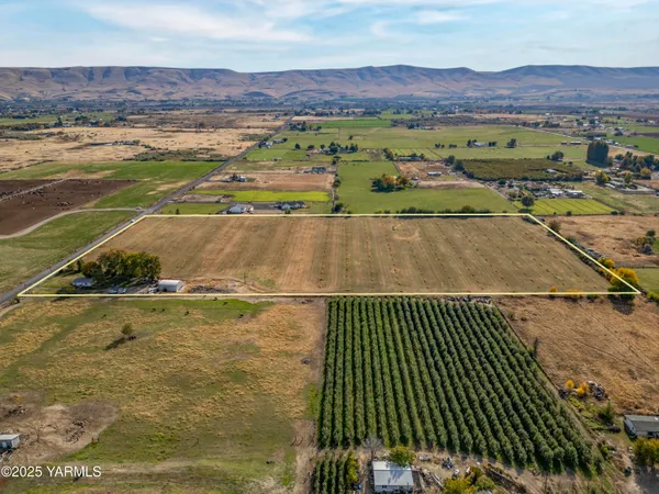 a view of a lake with houses in the back