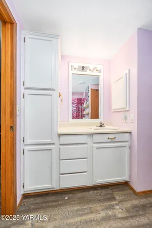 a view of cabinets with a wooden floor