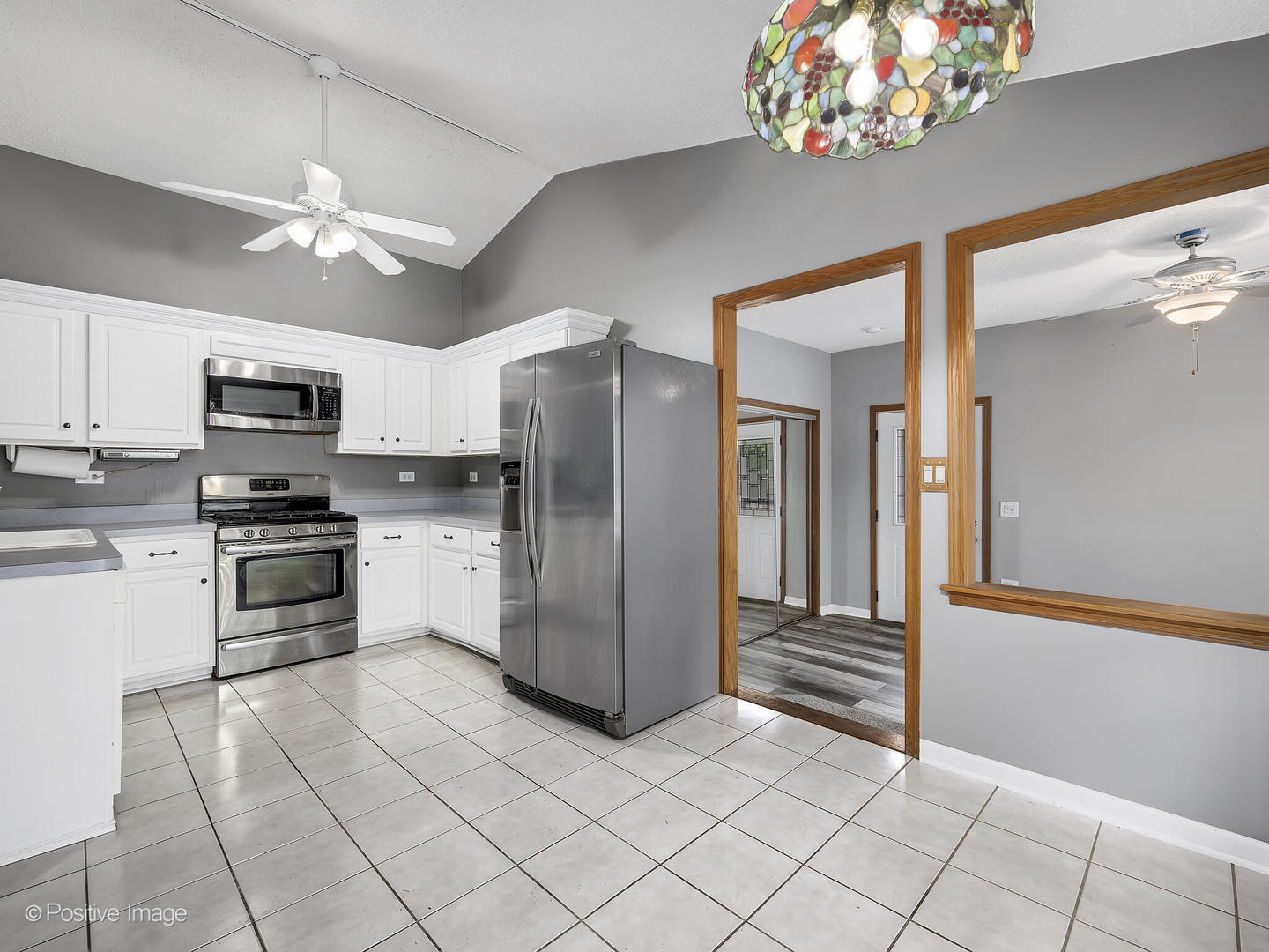 1985 Navarone Drive Naperville, IL 60565 - Photo 11 of 24 a kitchen with stainless steel appliances granite countertop a refrigerator a stove a microwave oven with cabinets