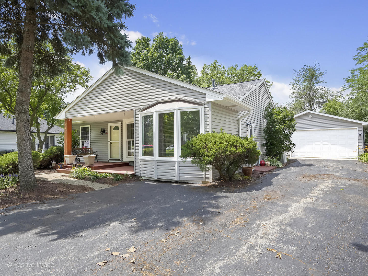 1985 Navarone Drive Naperville, IL 60565 - Photo 23 of 24 a view of a house with backyard sitting area and garden